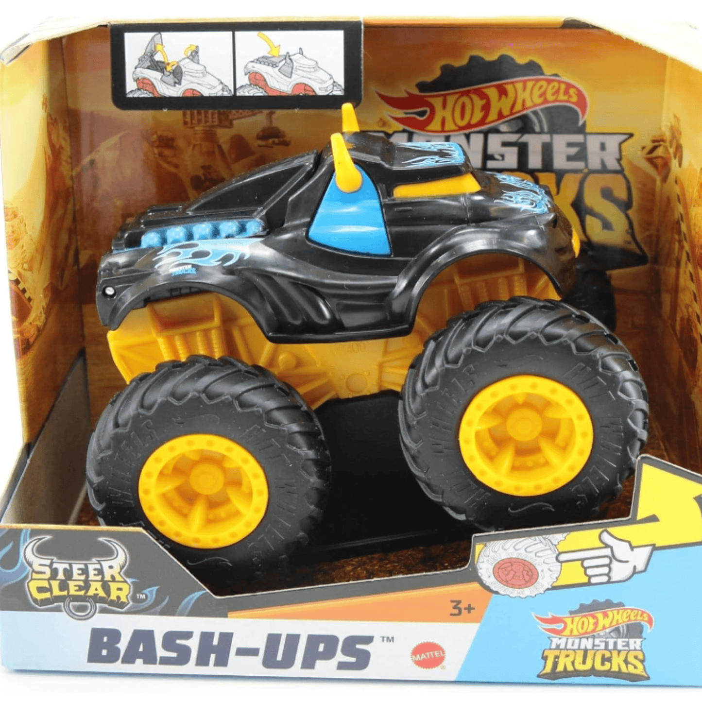 Imaginea prezintă un camion monstru Hot Wheels „Steer Clear” din seria „Bash-Ups” în ambalajul său. Camionul are un design negru cu accente albastre și galbene, având roți mari galbene. Este destinat copiilor de 3 ani și mai mari pentru joaca interactivă.